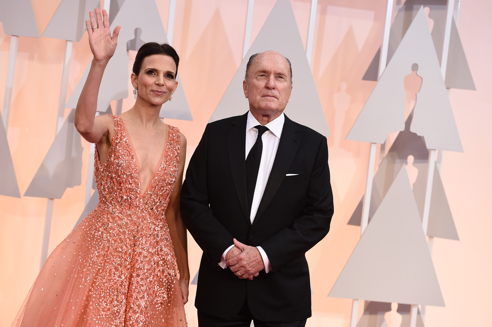 Luciana Duvall, left, and Robert Duvall arrive at the Oscars on Sunday, Feb. 22, 2015, at the Dolby Theatre in Los Angeles. (Photo by Jordan Strauss/Invision/AP)