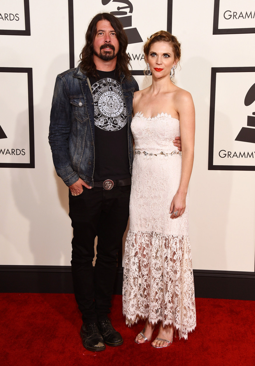 Dave Grohl, left, and Jordyn Blum arrive at the 57th annual Grammy Awards at the Staples Center on Sunday, Feb. 8, 2015, in Los Angeles. (Photo by Jordan Strauss/Invision/AP)