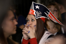 Courtney Lurate, of Boston, watches the New England Patriots play against the Seattle Seahawks in the NFL Super Bowl XLIX football game in Glendale, Ariz., Sunday, Feb. 1, 2015, at a bar in Boston. (AP Photo/Steven Senne)