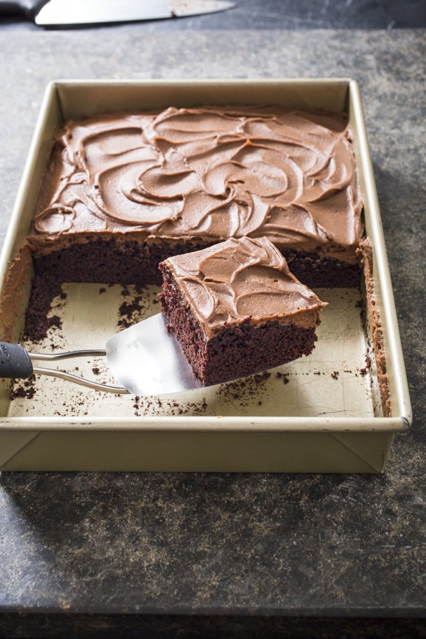 This undated photo provided by America's Test Kitchen in November 2018 shows a chocolate sheet cake in Brookline, Mass. This recipe appears in the "Complete Cookbook for Young Chefs." (Carl Tremblay/America's Test Kitchen via AP)
