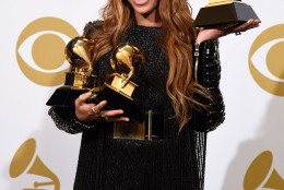 Beyonce poses in the press room with the awards for best R&B performance for “Drunk in Love”, best surround sound album for “Beyonce”, and best R&B song for “Drunk in Love” at the 57th annual Grammy Awards at the Staples Center on Sunday, Feb. 8, 2015, in Los Angeles. (Photo by c)