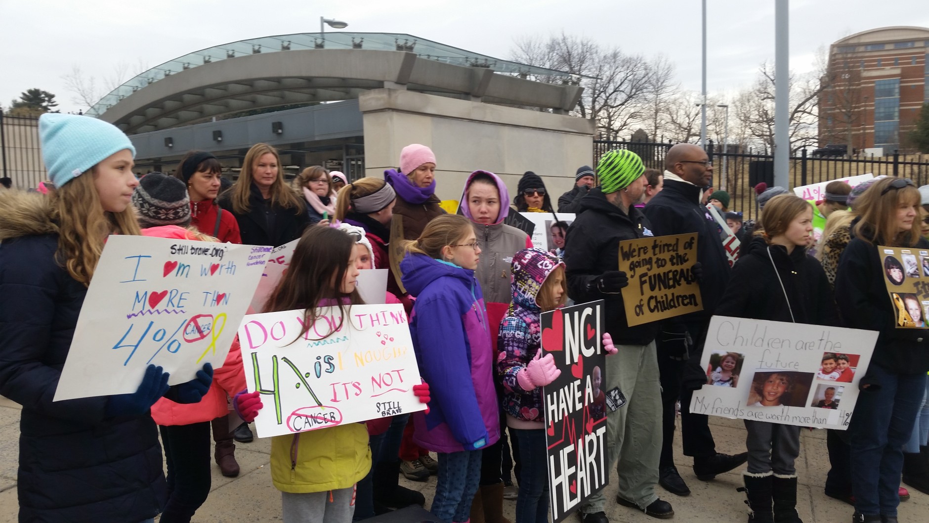 Demonstrators want the government to devote a higher percentage of funding to children's cancer. (WTOP/Allison Keyes)