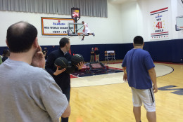 The event culminated with the dunk contest, performed off a trampoline. Wizards employees showed us how (we were supposed) to do it. (WTOP/Noah Frank)