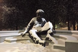 Snow coats the Albert Einstein Memorial in Northwest D.C. early Tuesday morning. (WTOP/Mitchell Miller)
