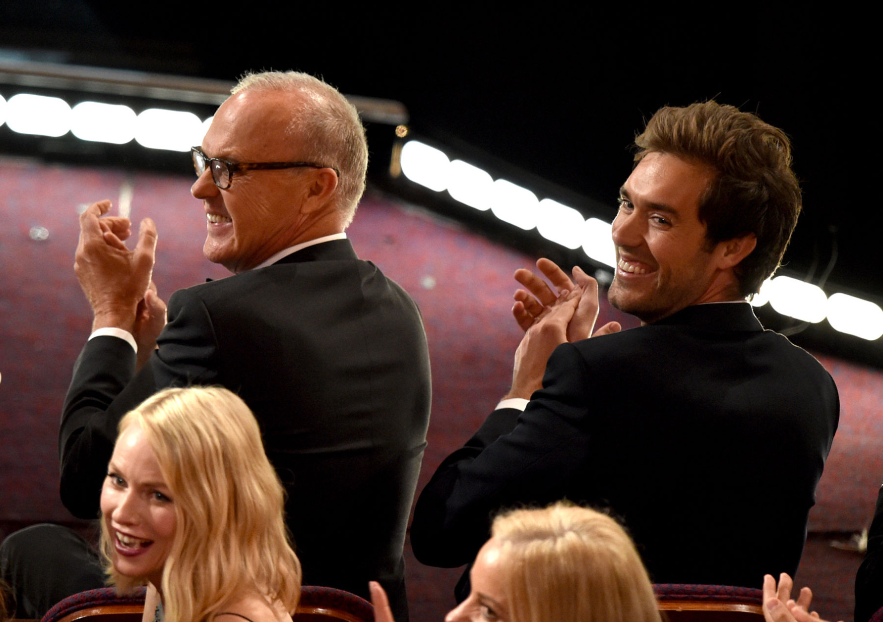 Michael Keaton, left, and Sean Douglas are seen in the audience at the Oscars on Sunday, Feb. 22, 2015, at the Dolby Theatre in Los Angeles. (Photo by John Shearer/Invision/AP)