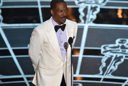 Eddie Murphy presents the award for best original screenplay at the Oscars on Sunday, Feb. 22, 2015, at the Dolby Theatre in Los Angeles. (Photo by John Shearer/Invision/AP)