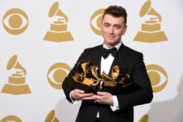 Sam Smith poses in the press room with the awards for best new artist, best pop vocal album for “In the Lonely Hour”, song of the year for “Stay With Me”, and record of the year for “Stay With Me” at the 57th annual Grammy Awards at the Staples Center on Sunday, Feb. 8, 2015, in Los Angeles. (Photo by Chris Pizzello/Invision/AP)