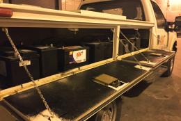New batteries sit in rows in a service truck. Battery problems are the most common call during extremely cold weather for AAA. (WTOP/Andrew Mollenbeck)