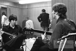 In a candid moment of true backstage access, Paul McCartney and John Lennon warm up on their guitars in anticipation of their show at Olympia Stadium in Detroit, Michigan, on August 13, 1966. The two-show stop in Detroit drew a combined audience of 30,800 rabid Beatles fans and had an impressive set list: Rock and Roll Music, She’s a Woman, If I Needed Someone, Baby’s In Black, Day Tripper, I Feel Fine, Yesterday, I Wanna Be Your Man, Nowhere Man, Paperback Writer and Long Tall Sally. In this photograph, the creative energy between Lennon and McCartney is palpable. The legendary duo collaborated on some of the biggest records the world has ever seen, and did it all with a healthy amount of friendly competition. A writer for The Atlantic summed up their partnership best: “John was the badass older brother Paul never had. Paul was a charming sidekick who could do something rare: keep up with John.” The pair are notorious for their own version of call-and-answer: John’s Strawberry Fields Forever was answered by Paul’s Penny Lane; John’s Revolution 1 by Paul’s Blackbird. And so, one of the greatest songwriting duos of all time was created - in competition and in brotherhood - and captured beautifully here.