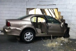 Two passengers in this car have been hospitalized after it crashed into the wall of this Giant grocery store in Van Ness. (WTOP/Dave Dildine)