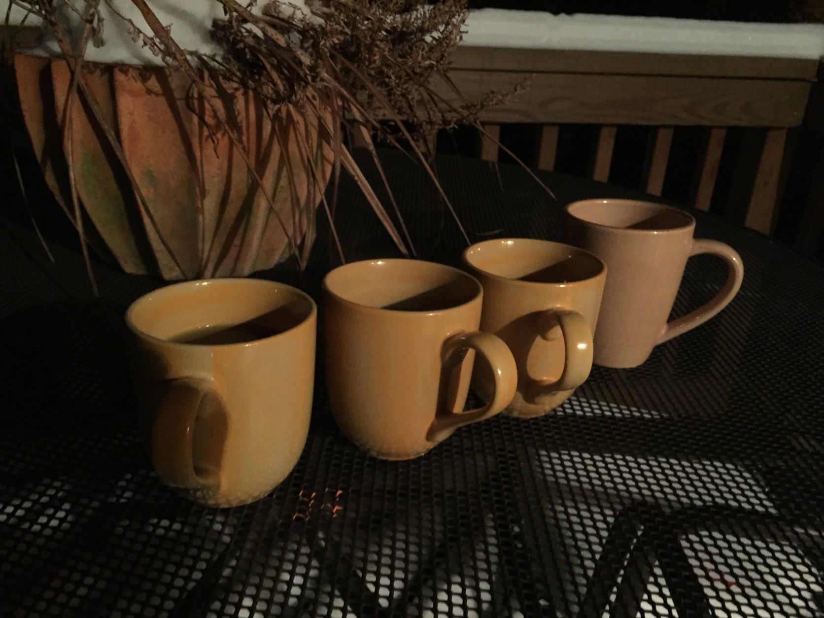 5:00am Cold apple juice, hot black coffee, tepid water, and cold 2-percent milk are put outside in 10-degree temperatures. (WTOP/Neal Augenstein)