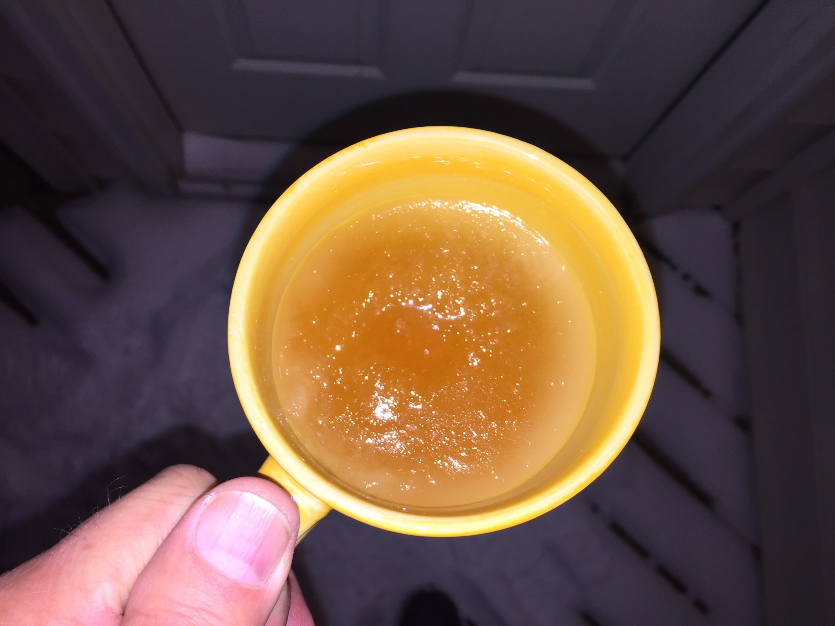 After 90 minutes outside, the apple juice has a thin, but solid layer of ice on top. (WTOP/Neal Augenstein)