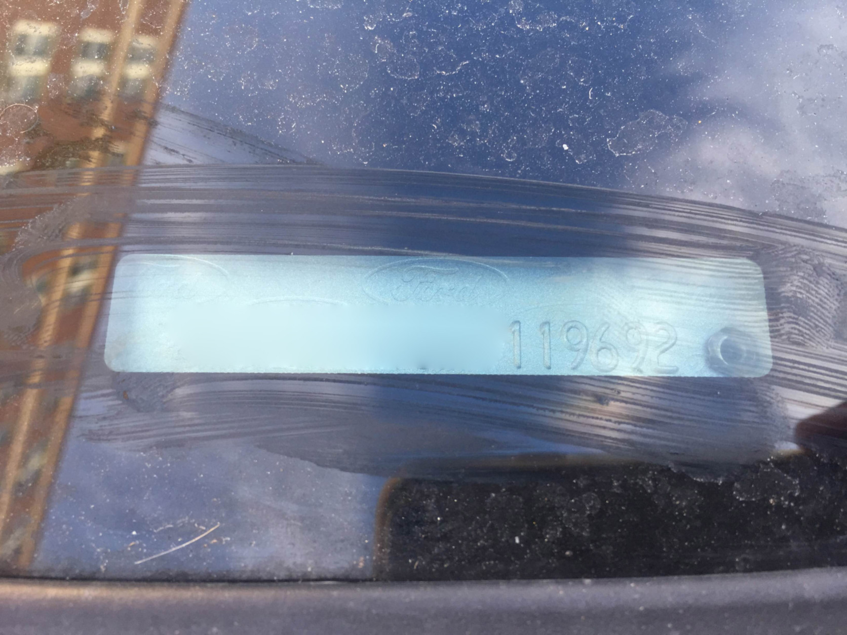 The tickets were issued because the license plate on the sticker is different than the actual plates, but as the photo reveal, the VIN numbers are identical. (WTOP/Ari Ashe)