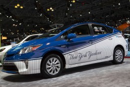 NEW YORK, NY - APRIL 17:   A Toyota Prius painted with New York Yankees colors sits on display during a media preview of the 2014 New York International Auto Show at the Jacob Javits Convention Center on April 17, 2014 in New York City. The show opens with a sneak preview to the public April 18 and runs through April 27.  (Photo by Eric Thayer/Getty Images)