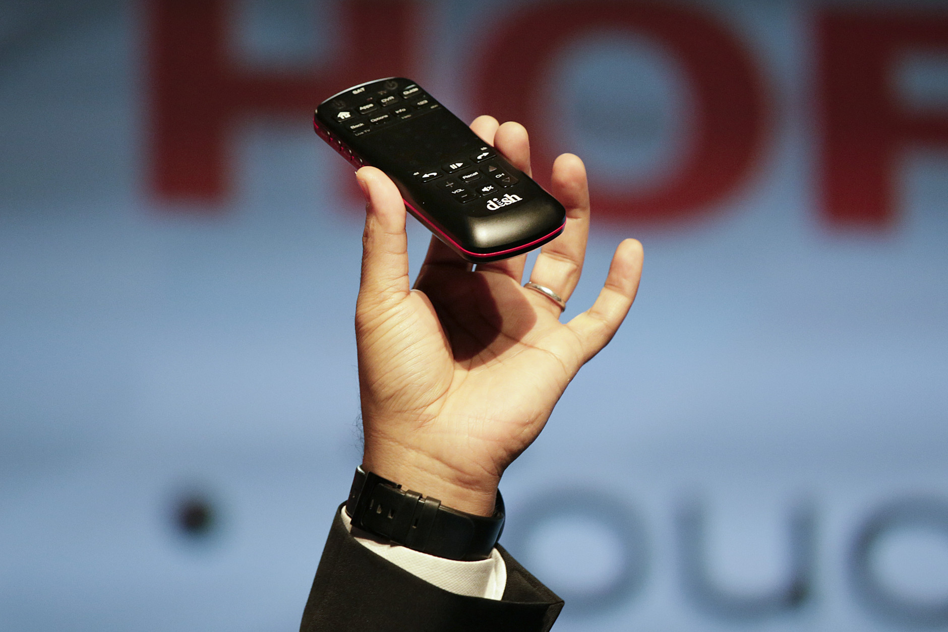 Vivek Khemka, senior vice president of product management at Dish, introduces the new Hopper voice remote during a news conference at the International CES, Monday, Jan. 5, 2015, in Las Vegas. (AP Photo/Jae C. Hong)