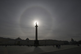 A giant circle is seen during the solar eclipse around the sun over Alexander Column at Dvortsovaya (Palace) Square in St.Petersburg, Russia, Friday, March 20, 2015. An eclipse is darkening parts of Europe on Friday in a rare solar event that won't be repeated for more than a decade.(AP Photo/Dmitry Lovetsky)