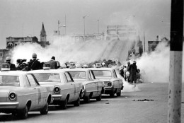 FILE - In this March 7, 1965 file photo, clouds of tear gas fill the air as state troopers, ordered by Gov. George Wallace, break up a demonstration march in Selma, Ala., on what became known as "Bloody Sunday." The incident is widely credited for galvanizing the nation's leaders and ultimately yielded passage of the Voting Rights Act of 1965. (AP Photo/File)