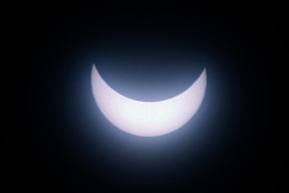 The sun is seen during an eclipse in Marseille, southern France, Friday, March 20, 2015. An eclipse is darkening parts of Europe on Friday in a rare solar event that won't be repeated for more than a decade. (AP Photo/Claude Paris)