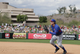 Actor Will Ferrell plays first base for the Chicago Cubs during the Cubs' spring training baseball game against the Los Angeles Angels in Tempe, Ariz., on Thursday, March 12, 2015. The comedian planned to play every position while making appearances at five Arizona spring training games Thursday. (AP Photo/Chris Carlson)