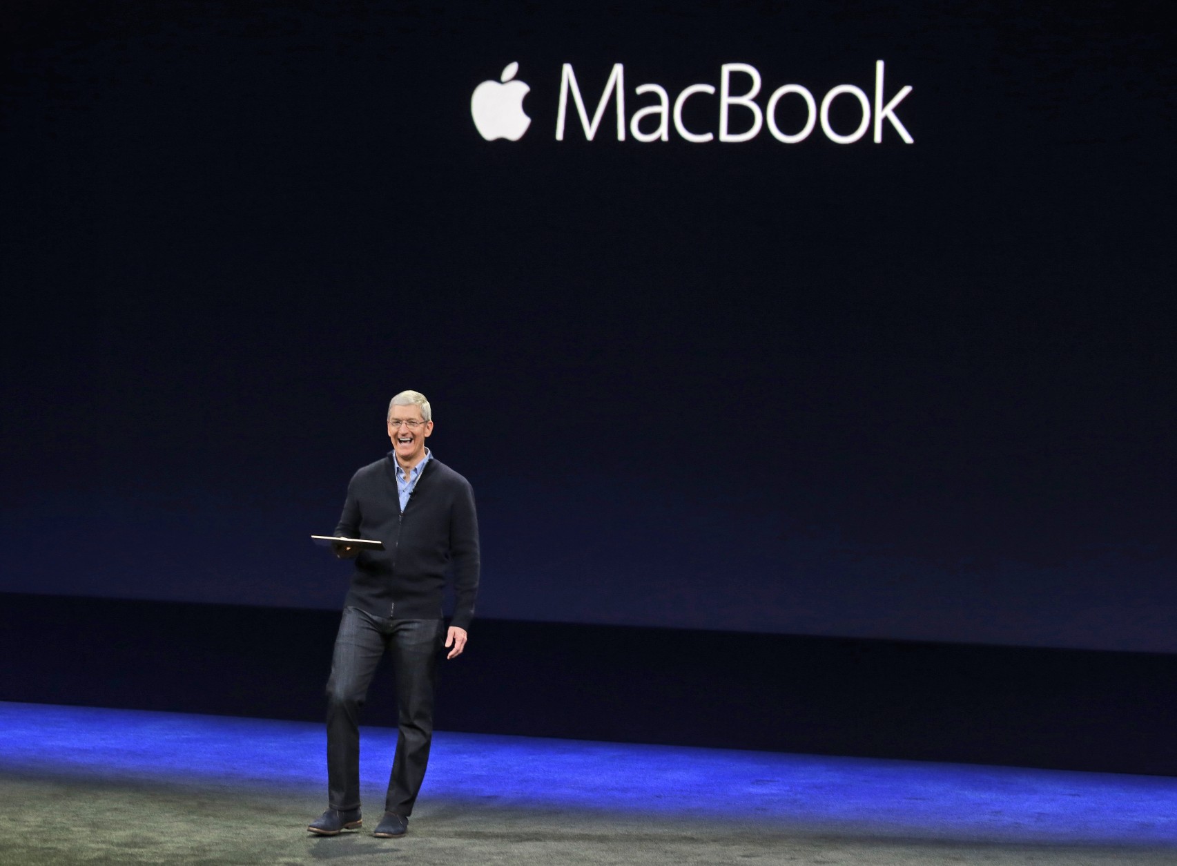 Apple CEO Tim Cook introduces the new Apple MacBook during an Apple event on Monday, March 9, 2015, in San Francisco. (AP Photo/Eric Risberg)