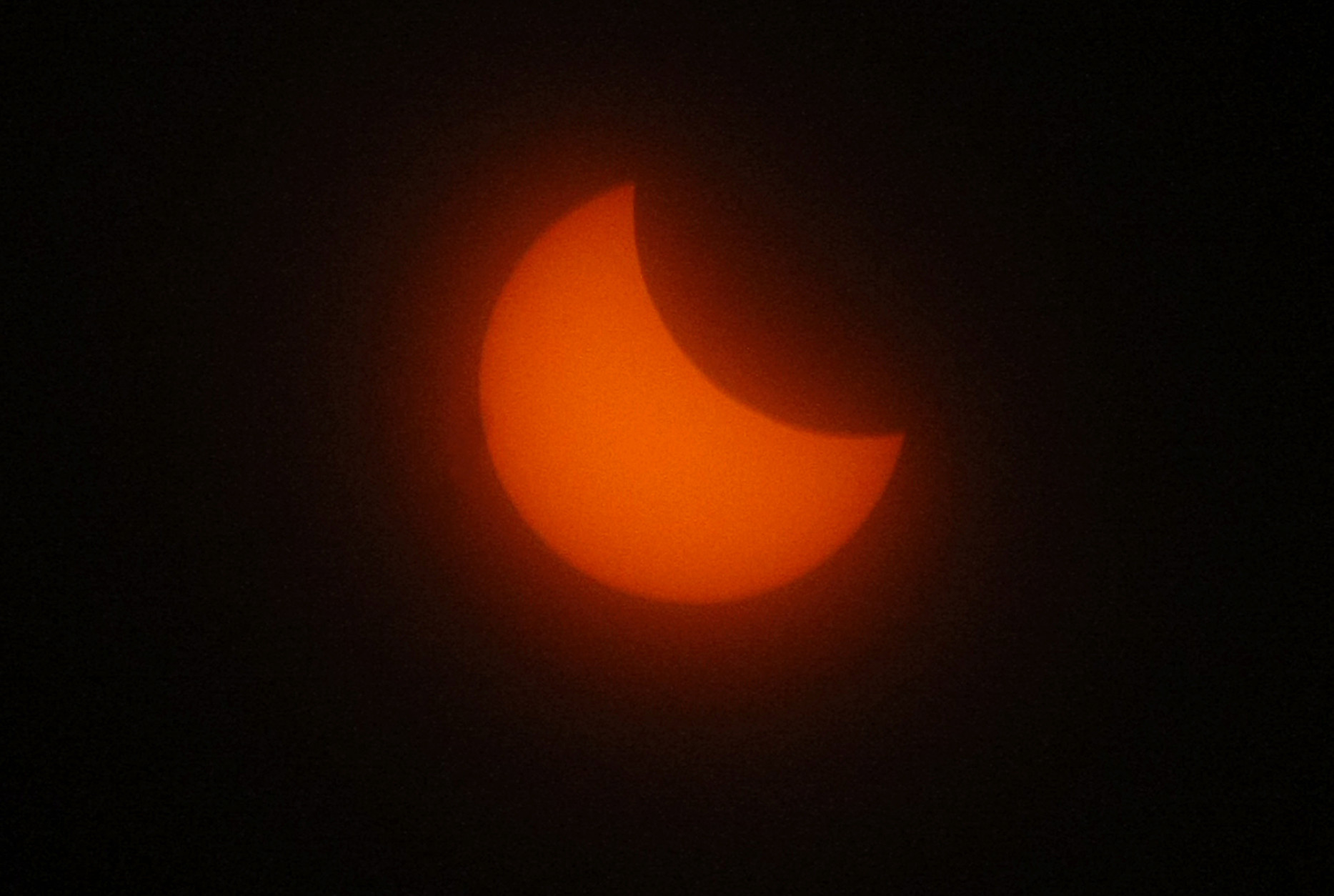 The sun is seen during a solar eclipse in Marseille, southern France, Friday, March 20, 2015. An eclipse is darkening parts of Europe on Friday in a rare solar event that won't be repeated for more than a decade. (AP Photo/Claude Paris)