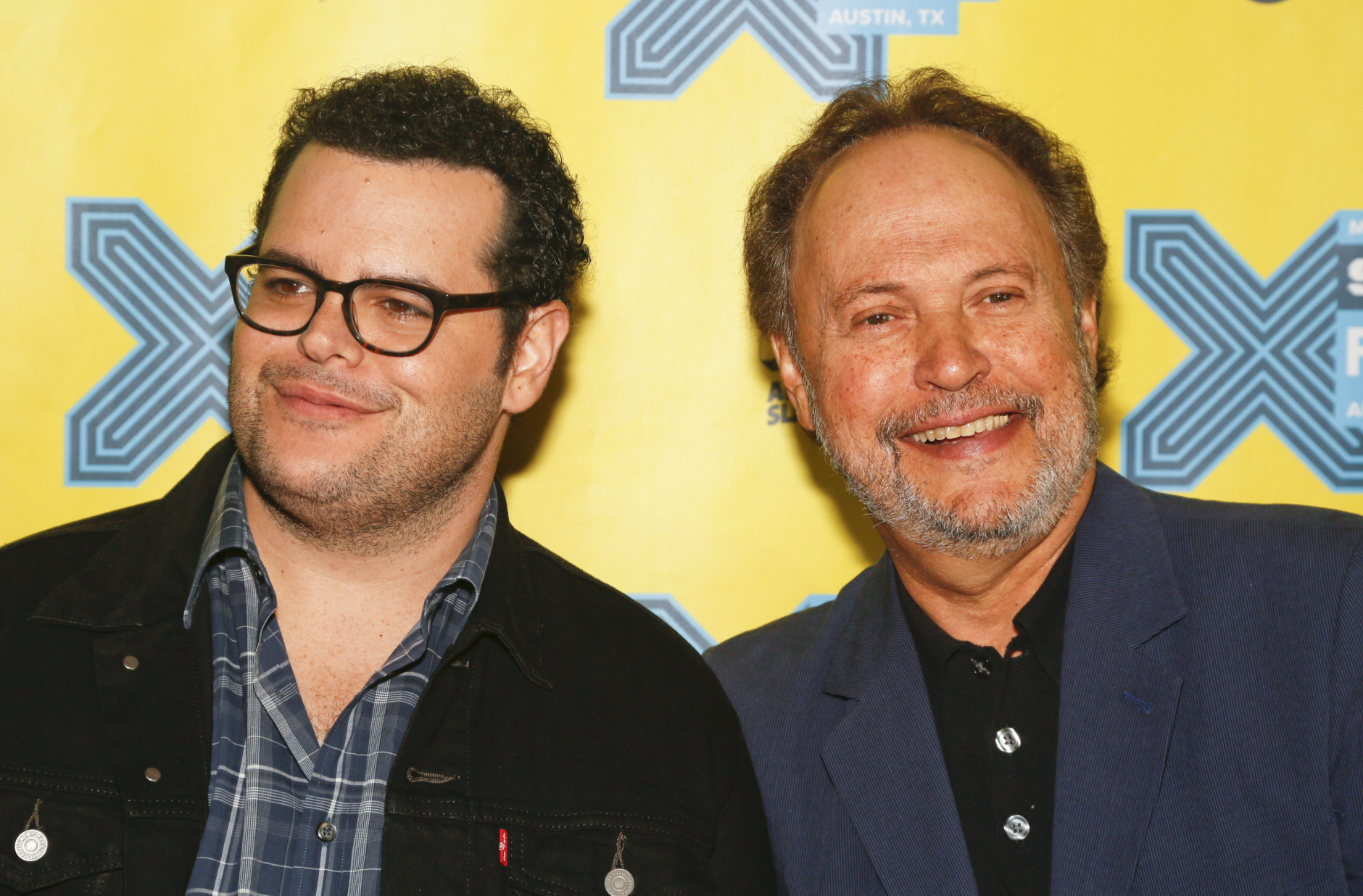 Josh Gad, left, and Billy Crystal walk the red carpet for "The Comedians" during the South by Southwest Film Festival on Sunday, March 15, 2015 in Austin, Texas. (Photo by Jack Plunkett/Invision/AP)