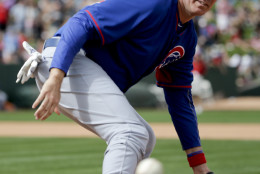 Actor Will Ferrell play first base for the Chicago Cubs during a spring training baseball exhibition game against the Los Angeles Angels in Tempe, Ariz., on Thursday, March 12, 2015. The comedian plans to play every position while making appearances at five Arizona spring training games on Thursday. (AP Photo/Chris Carlson)