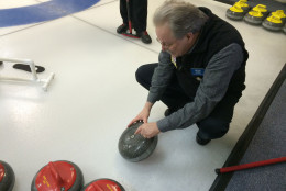 The reason curling stones travel so smoothly down the ice, despite their 42-pound weight, is that the only part of the stone that actually touches the ice is a small inner ring that has been carved out. (WTOP/Noah Frank)