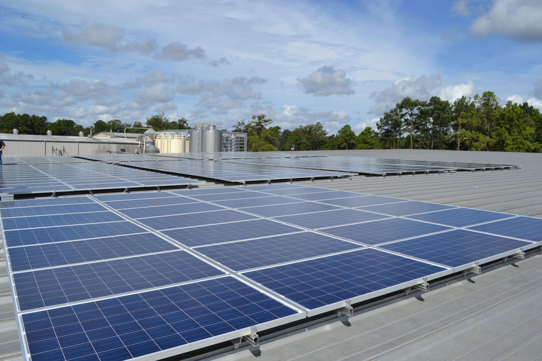 This photo released by Abita Brewing Co. shows  their recently unveiled 340-panel 84 kilowatt photovoltaic rooftop solar system that it will use to power its brew house, Friday, Sept. 20, 2013. (AP Photo/Abita Brewing Co.)
