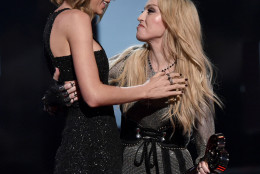 Madonna, right, presents the award for song of the year to Taylor Swift for “Shake It Off” at the iHeartRadio Music Awards at The Shrine Auditorium on Sunday, March 29, 2015, in Los Angeles. (Photo by John Shearer/Invision for iHeartRadio/AP Images)