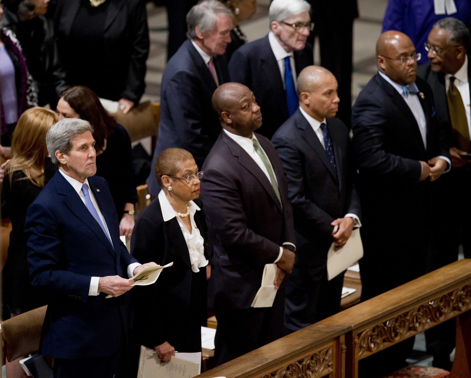 Front row, from left are, Secretary of State John Kerry, Del. Eleanor Holmes Norton, D-D.C., Sen. Tim Scott, R-S.C., and former Massachusetts Gov. Deval Patrick attend the funeral services for former Massachusetts Sen. Edward William Brooke III, Tuesday, March 10, 2015, at the Washington National Cathedral in Washington.  Brooke, the first African-American to be popularly elected to the U.S. Senate, died on Jan. 3, 2015 at his home in Coral Gables, Fla. He was 95. Sen. Edward Markey, D-Mass. and former Virginia Sen. John Warner are in the second row,  (AP Photo/Manuel Balce Ceneta)