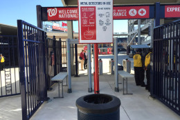 A sign alerts fans to the newly installed metal detectors at Nationals Park. (WTOP/Andrew Mollenbeck)