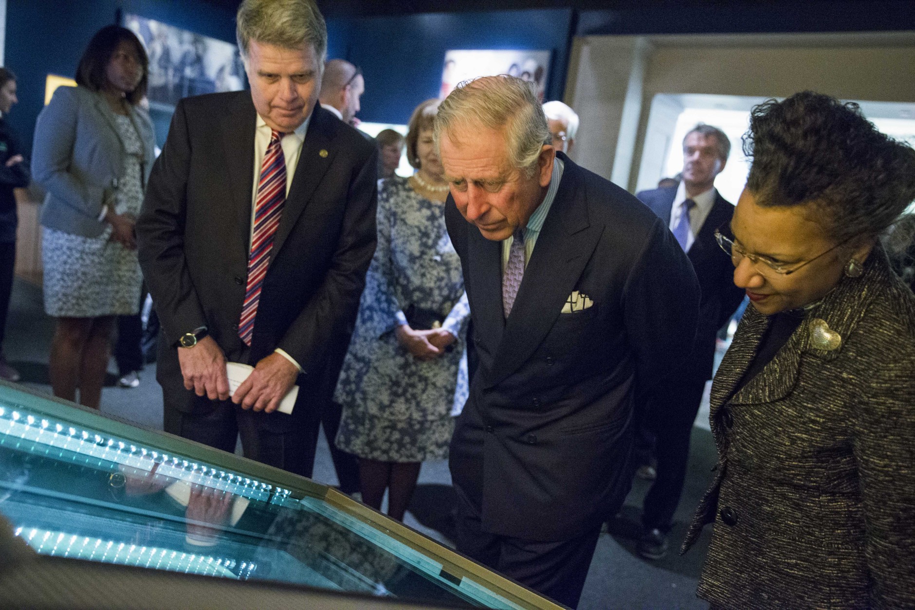 Britain's Prince Charles looks at an original copy of the Magna Carta during a visit to the National Archives in Washington, Wednesday, March 18, 2015. Prince Charles and his wife Camilla, Duchess of Cornwall, are scheduled to visit cultural and educational sites over the next three days. (AP Photo/ Evan Vucci)