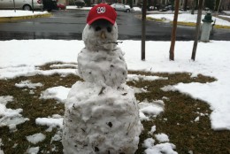This snow man is ready for spring and the Nationals home opener.  (WTOP/Mike Jakaitis)