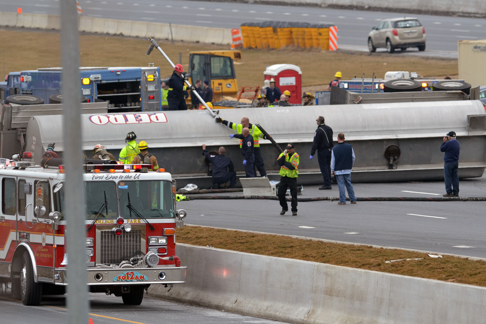Emergency crews respond to a crash involving a  tanker truck overturned on Interstate 95 in Laurel, Md., after a crash Tuesday morning. The tanker lost more than 700 gallons of fuel. (Courtesy Bill Vaughan)