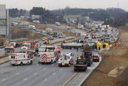 An overturned tanker truck remains on its side on Interstate 95 in Laurel Tuesday, March 10, 2015. The tanker spilled as much as 400 gallons of biodiesel. (Prince George's County Fire Department)