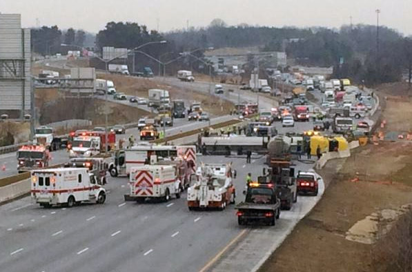 An overturned tanker truck remains on its side on Interstate 95 in Laurel Tuesday, March 10, 2015. The tanker spilled as much as 400 gallons of biodiesel. (Prince George's County Fire Department)