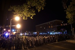 BALTIMORE, MD - APRIL 28:  Riot police line the street after curfew and dispensing tear gas the night following citywide riots over the death of Freddie Gray on April 28, 2015 in Baltimore, Maryland. Freddie Gray, 25, was arrested for possessing a switch blade knife April 12 outside the Gilmor Houses housing project on Baltimore's west side. According to his attorney, Gray died a week later in the hospital from a severe spinal cord injury he received while in police custody. (Photo by Mark Makela/Getty Images)