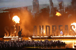 Dwayne Johnson appears on stage to present the award for movie of the year at the MTV Movie Awards at the Nokia Theatre on Sunday, April 12, 2015, in Los Angeles. (Photo by Matt Sayles/Invision/AP)