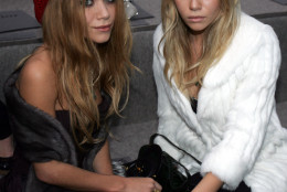 ** FILE ** Twin actresses Mary-Kate, left, and Ashley Olsen pose for the press prior to the  presentation of the Spring-Summer 2007 ready to wear collection by British designer John Galliano for French fashion house Dior in Paris, in this Oct. 3, 2006 file photo. The Olsen twins are hoping to spread a little "Influence."  Mark Kate-Olsen and Ashley Olsen are working on a coffee table book about fashion, called "Influence," that a division of Penguin Group (USA) will release in the fall. (AP Photo/Remy de la Mauviniere, File)