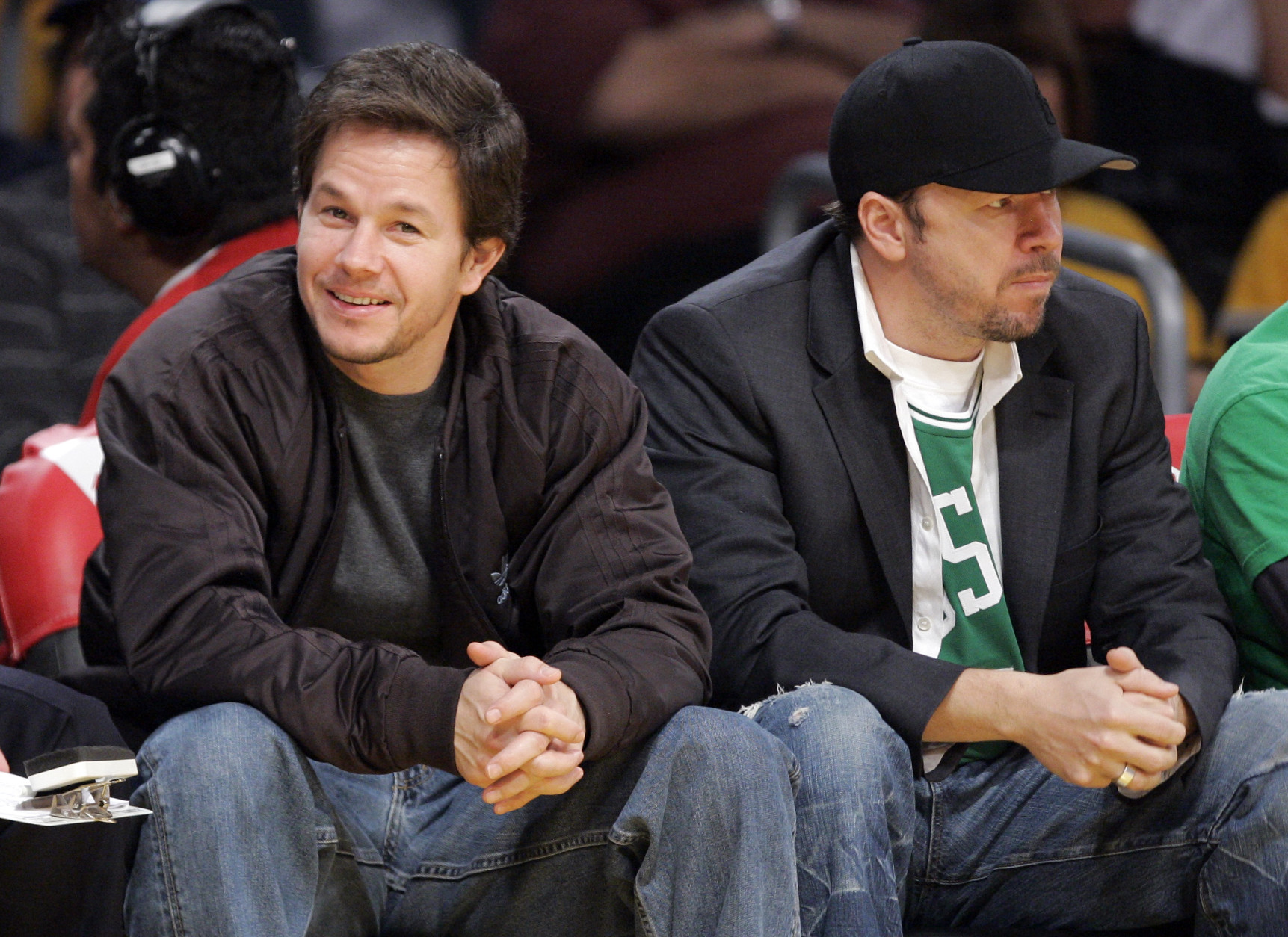 Actor Mark Wahlberg, left, sits with his brother Donnie as they watch the Boston Celtics play the Los Angeles Lakers in their NBA basketball game, Sunday, Dec. 30, 2007, in Los Angeles. (AP Photo/Mark J. Terrill)