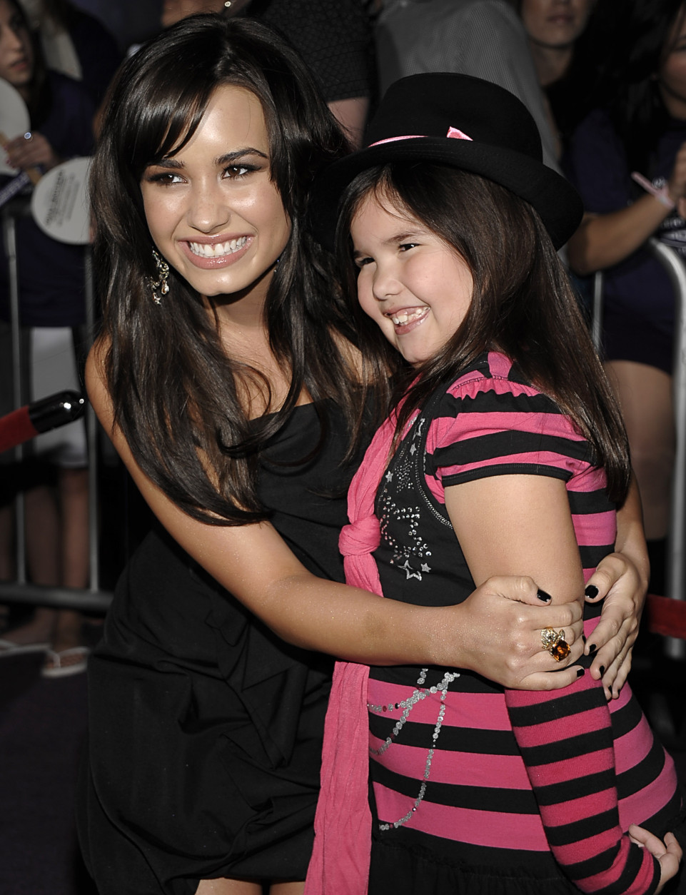 Singer Demi Lovato, left, and her sister, actress Madison De La Garza pose on the press line at the premiere of "Jonas Brothers: The 3D Concert Experience" in Hollywood, Calif. on Tuesday, Feb. 24, 2009. (AP Photo/Dan Steinberg)
