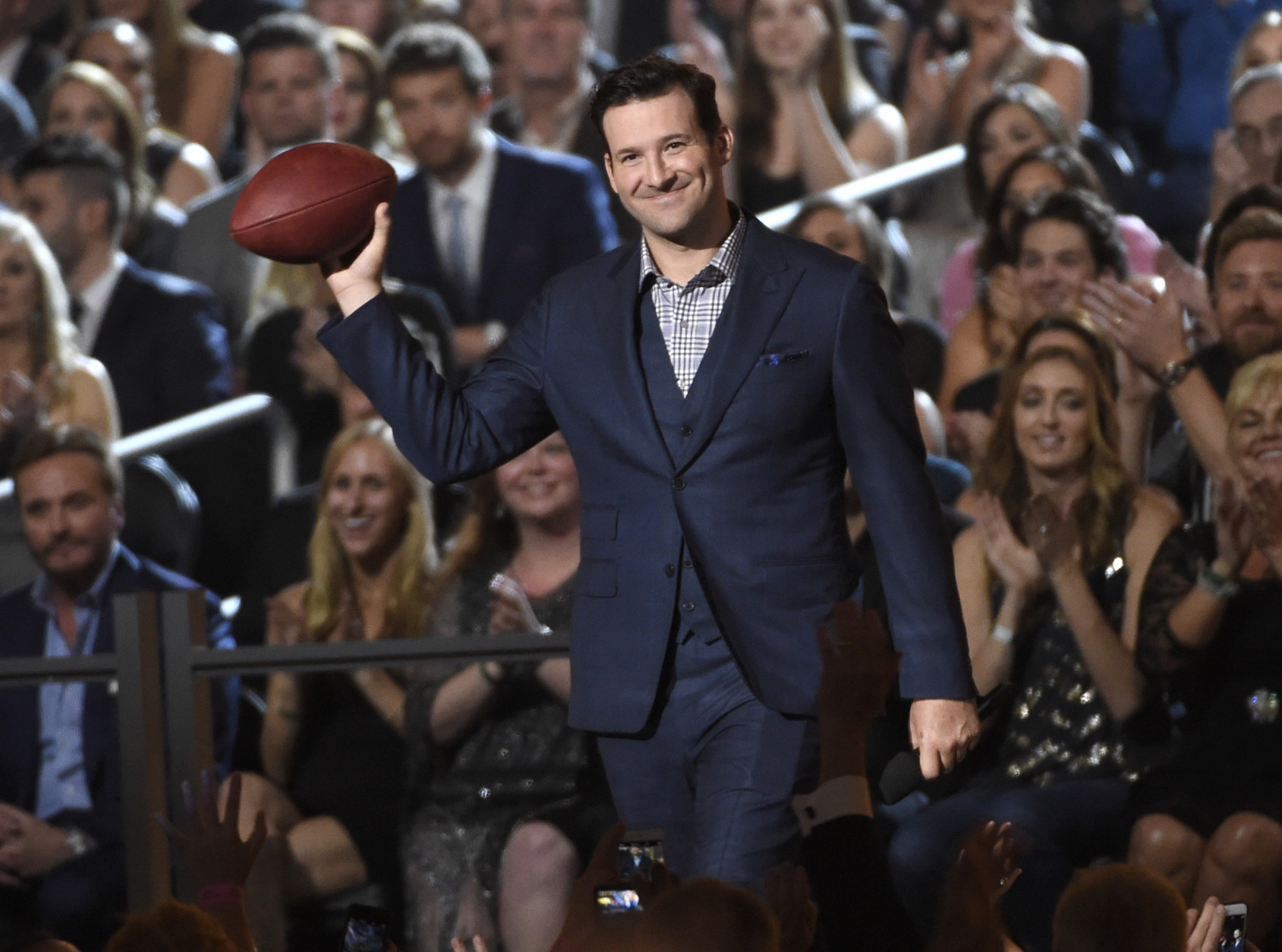 Tony Romo walks on stage at the 50th annual Academy of Country Music Awards at AT&amp;T Stadium on Sunday, April 19, 2015, in Arlington, Texas. (Photo by Chris Pizzello/Invision/AP)