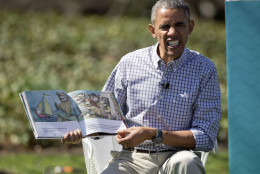 President Barack Obama makes a face as he reads "Where the Wild Things Are" by Maurice Sendak, during the White House Easter Egg Roll on the South Lawn of the White House is Washington, Monday, April 6, 2015. Thousands of children gathered at the White House for the annual Easter Egg Roll. This year’s event features live music, cooking stations, storytelling, and of course, some Easter egg roll. (AP Photo/Pablo Martinez Monsivais)