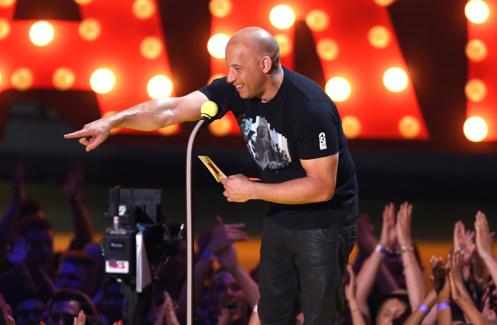 Vin Diesel presents the award for best female performance at the MTV Movie Awards at the Nokia Theatre on Sunday, April 12, 2015, in Los Angeles. (Photo by Matt Sayles/Invision/AP)