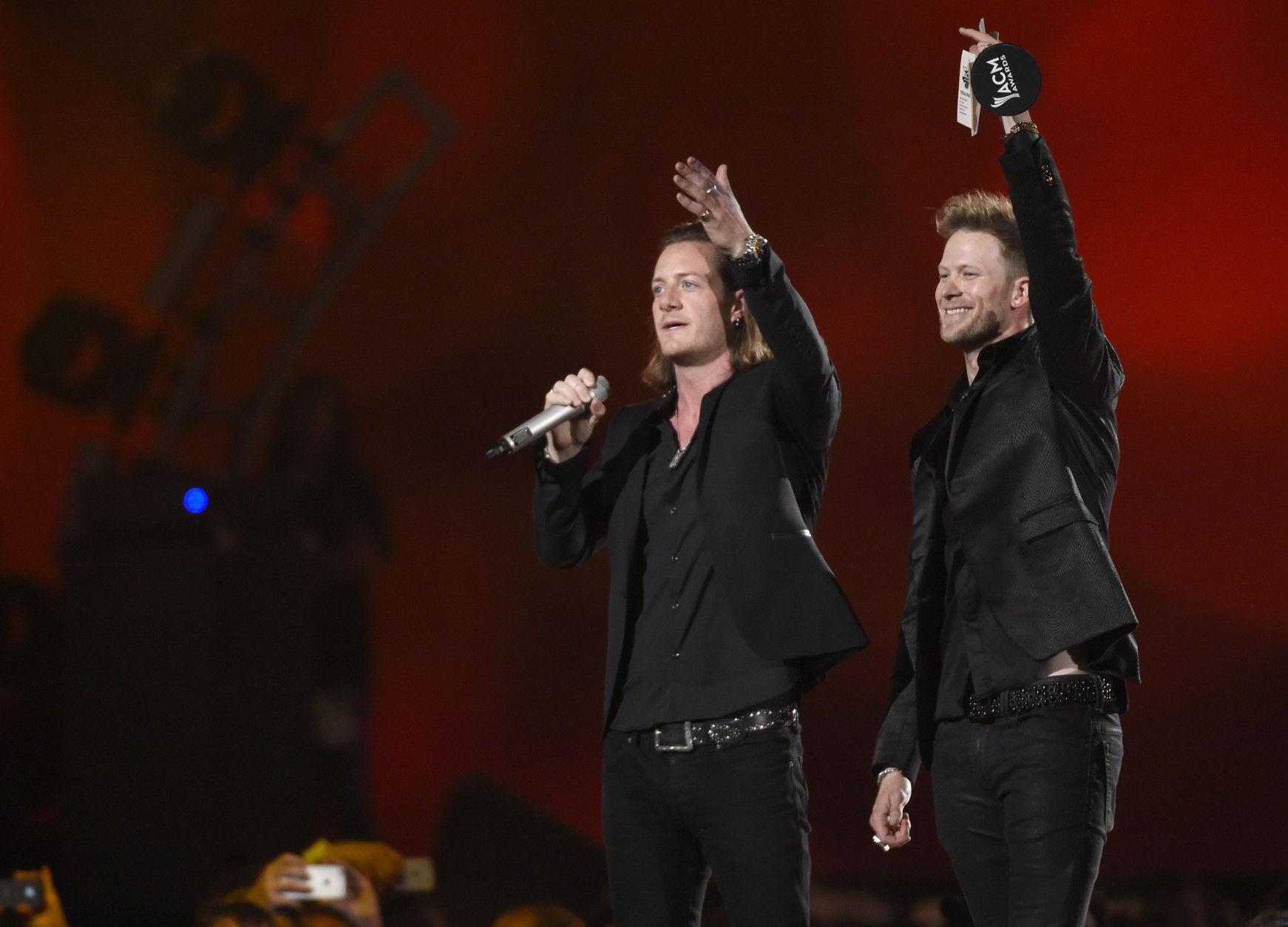 Tyler Hubbard, left, and Brian Kelley, of Florida Georgia Line, accept the award for vocal duo of the year at the 50th annual Academy of Country Music Awards at AT&amp;T Stadium on Sunday, April 19, 2015, in Arlington, Texas. (Photo by Chris Pizzello/Invision/AP)