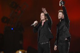 Tyler Hubbard, left, and Brian Kelley, of Florida Georgia Line, accept the award for vocal duo of the year at the 50th annual Academy of Country Music Awards at AT&amp;T Stadium on Sunday, April 19, 2015, in Arlington, Texas. (Photo by Chris Pizzello/Invision/AP)