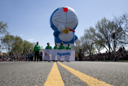 A huge Doraemon balloon is moved down Constitution Avenue during the Parade of the National Cherry Blossom Festival, Saturday, April 11, 2015, in Washington. (AP Photo/Carolyn Kaster)