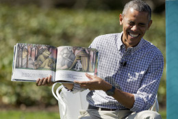 President Barack Obama begins to laugh as he reads "Where the Wild Things Are" by Maurice Sendak, during the White House Easter Egg Roll on the South Lawn of the White House is Washington, Monday, April 6, 2015. Thousands of children gathered at the White House for the annual Easter Egg Roll. This year's event features live music, cooking stations, storytelling, and of course, some Easter egg roll. (AP Photo/Pablo Martinez Monsivais)