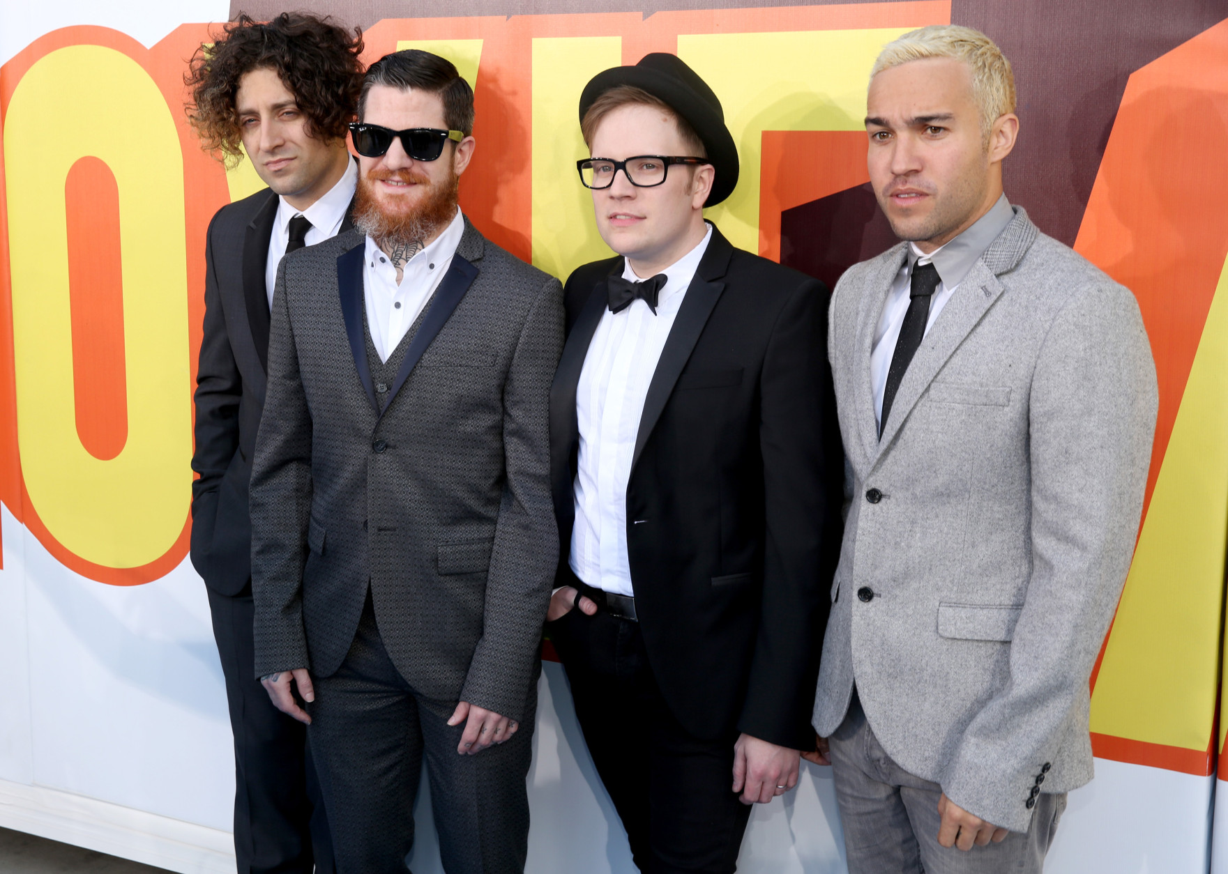 Joe Trohman, from left, Andy Hurley, Patrick Stump and Pete Wentz, of Fall Out Boy, arrive at the MTV Movie Awards at the Nokia Theatre on Sunday, April 12, 2015, in Los Angeles. (Photo by Matt Sayles/Invision/AP)